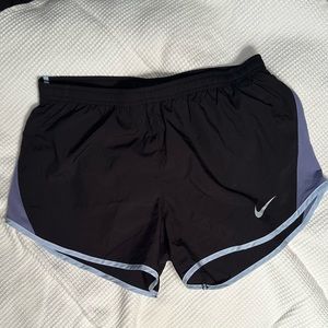 Nike Women’s Tempo black running shorts with dusty purple  trim. size S